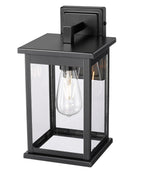 11"H Bowton II Outdoor Wall Light - Dusk to Dawn Matte Black Finish with Glass Shade by Millennium Lighting